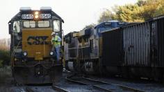 FILE PHOTO: A CSX coal train (R) moves past an idling CSX engine at the switchyard in Brunswick, Maryland October 16, 2012.  REUTERS/Gary Cameron 