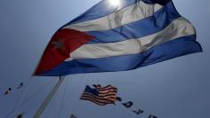 Flags of Cuba and U.S are seen at the Marina Hemingway during the arrival of the grandsons of the U.S. author Ernest Hemingway to Havana 