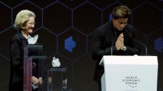 Actor Shah Rukh Khan reacts after receiving a Crystal Award from Hilde Schwab, Chairperson and Co-Founder, Schwab Foundation for Social Entrepreneurship, during the World Economic Forum (WEF) annual meeting in Davos