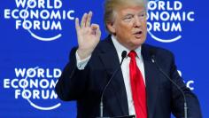 U.S. President Donald Trump gestures as he delivers a speech during the World Economic Forum (WEF) annual meeting in Davos, Switzerland January 26, 2018. REUTERS/Denis Balibouse