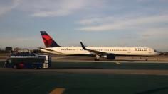 A Delta plane passes a Delta bus on the tarmac at LAX airport in Los Angeles, California U.S. January 10, 2018. REUTERS/Lucy Nicholson