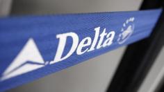 The Delta airline logo is seen on a strap at JFK Airport in New York, July 30, 2008. Delta Air Lines Inc on Wednesday announced a award travel structure for its Skymiles frequent flier program.  REUTERS/Joshua Lott (UNITED STATES)