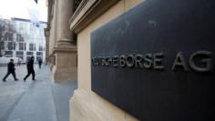 FILE PHOTO: The plaque of the Deutsche Boerse AG is pictured at the entrance of the Frankfurt stock exchange February 1, 2012. REUTERS/Alex Domanski/File Photo                 