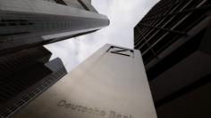 The logo of Germany's largest business bank, Deutsche Bank is seen in front of one of the bank's office buildings in Frankfurt, Germany, October 27, 2016.   REUTERS/Kai Pfaffenbach  