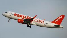 FILE PHOTO: EasyJet Airbus A320-200 aircraft takes-off from Zurich Airport