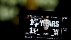 Julian Assange, Founder and Editor-in-Chief of WikiLeaks speaks via video link during a press conference on the occasion of the ten year anniversary celebration of WikiLeaks in Berlin