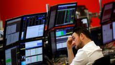 FILE PHOTO: A market maker works on the trading floor at IG Index in London, Britain January 14, 2016.  REUTERS/Stefan Wermuth/File Photo