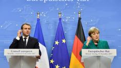 French President Emmanuel Macron and German Chancellor Angela Merkel give a joint news conference after the EU summit in Brussels, Belgium, December 15, 2017. REUTERS/Eric Vidal