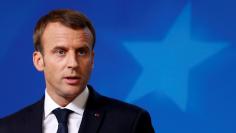 French President Emmanuel Macron addresses a news conference during a European Union leaders summit in Brussels, Belgium, October 20, 2017.  REUTERS/Geoffroy Van Der Hasselt - RC1B551F9550