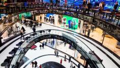 People walk through the Mall of Berlin shopping centre during its opening night in Berlin, September 24, 2014.  REUTERS/Thomas Peter/File Photo           