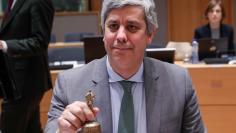 President of the Eurogroup Mario Centeno rings a bell at the start of an eurozone finance ministers meeting in Brussels, Belgium, January 22, 2018. REUTERS/Yves Herman