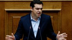 Greek PM Tsipras addresses lawmakers before an omnibus bill vote in Athens