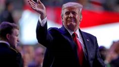 Jan 8, 2018; Atlanta, GA, USA; President Donald Trump walks onto the field before the 2018 CFP national championship college football game between the Georgia Bulldogs and the Alabama Crimson Tide at Mercedes-Benz Stadium. Mandatory Credit: Jason Getz-US