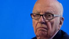 FILE PHOTO: Rupert Murdoch reacts during a panel discussion at the B20 meeting of company CEOs in Sydney, July 17, 2014. REUTERS/Jason Reed//File Photo 