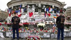 French Republican guards stand during a ceremony at Place de la Republique square to pay tribute to the victims of last year's shooting at the French satirical newspaper Charlie Hebdo, in Paris, France, January 10, 2016. REUTERS/Yohan Valat/Pool