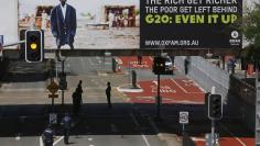 Police guard cleared streets near the venue of the annual G20 leaders summit in Brisbane November 14, 2014.   REUTERS/Jason Reed 