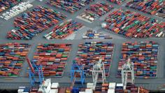 FILE PHOTO: A container ship is loaded at a terminal in the harbour of Hamburg, Germany September 23, 2012.     REUTERS/Fabian Bimmer/File Photo