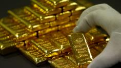 An employee sorts gold bars in the Austrian Gold and Silver Separating Plant 'Oegussa' in Vienna