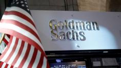 FILE PHOTO:  A view of the Goldman Sachs stall on the floor of the New York Stock Exchange in New York, U.S., July 16, 2013.     REUTERS/Brendan McDermid/File Photo