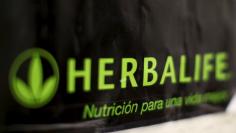 An Herbalife logo is shown on a poster at a clinic in the Mission District in San Francisco, California April 29, 2013.   REUTERS/Robert Galbraith/File Photo         