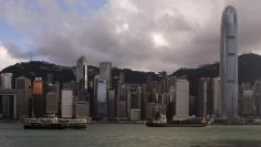 A Star Ferry sails past Hong Kong's business Central district June 18, 2014. REUTERS/Bobby Yip  