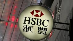 FILE PHOTO: Logo of HSBC is displayed outside a branch at the financial Central district in Hong Kong