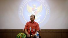 New chief of Indonesia's National Cyber and Encryption Agency Setiadi listens to a journalist's question during a briefing with members of the media in Jakarta