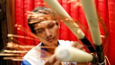 A worker counts copper wires at PT Voksel Electric at Cibubur district on the outskirts of Jakarta August 23, 2013.  REUTERS/Beawiharta 