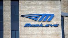 FILE PHOTO: The logo Israeli driverless technology firm Mobileye is seen on the building of their offices in Jerusalem March 13, 2017. REUTERS/Ronen Zvulun   