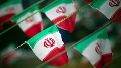 FILE PHOTO: Iran's national flags are seen on a square in Tehran