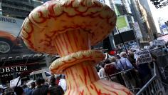 An inflatable mushroom cloud stands among demonstrators during a rally apposing the nuclear deal with Iran in Times Square in the Manhattan borough of New York