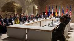 Negotiators of Iran and six world powers face each other at a table in the historic basement of Palais Coburg hotel in Vienna April 24, 2015. REUTERS/Heinz-Peter Bader