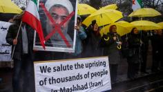 FILE PHOTO: Opponents of Iranian President Hassan Rouhani hold a protest outside the Iranian embassy in west London