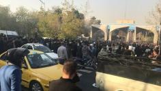 People protest near the university of Tehran