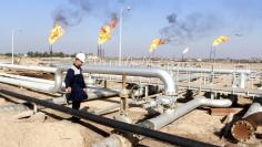 A worker walks at Nahr Bin Umar oil field, north of Basra, Iraq December 21, 2015.  REUTERS/Essam Al-Sudani  