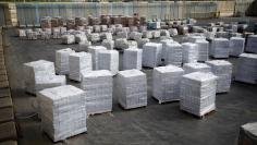 Boxes containing aid from the U.N. Relief and Works Agency (UNRWA) are seen ahead of their transfer to the Gaza Strip, inside the Kerem Shalom border crossing terminal between Israel and Gaza Strip January 16, 2018. REUTERS/Amir Cohen