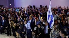 Likud party members vote during a Likud Central Committee meeting in Airport City