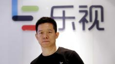 FILE PHOTO: Jia Yueting, co-founder and head of Le Holdings Co Ltd, also known as LeEco and formerly as LeTV, poses for a photo in front of a logo of his company after a Reuters interview at LeEco headquarters in Beijing, China April 22, 2016. REUTERS/Ja