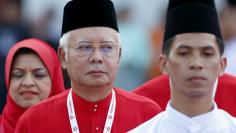 FILE PHOTO: Malaysia's Prime Minister Najib Razak inspects the United Malays National Organisation (UMNO) youth during the annual assembly at the Putra World Trade Centre in Kuala Lumpur