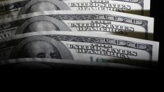 A picture illustration shows U.S. 100 dollar bank notes taken in Tokyo August 2, 2011.  REUTERS/Yuriko Nakao 