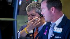 Traders work on the floor of the New York Stock Exchange August 25, 2015.  REUTERS/Brendan McDermid 