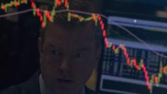 A specialist trader is reflected on his screen on the floor of the New York Stock Exchange August 25, 2015. REUTERS/Brendan McDermid 