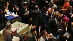 People wait in line to meet a job recruiter at the UJA-Federation Connect to Care job fair in New York March 6, 2013. REUTERS/Shannon Stapleton