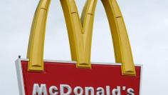 A McDonald's sign is shown outside one of their restaurants in Encinitas, California January 29, 2015. REUTERS/Mike Blake