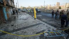 Iraqi security forces inspect the site of a bomb attack in Baghdad, Iraq January 15, 2018. REUTERS/Khalid al Mousily