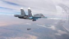 A frame grab taken from footage released by Russia's Defence Ministry October 9, 2015, shows a Russian Su-34 fighter-bomber dropping a bomb in the air over Syria.  REUTERS/Ministry of Defence of the Russian Federation/Handout via Reuters 
