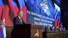 Russian President Vladimir Putin addresses the audience during an annual meeting at the Defence Ministry in Moscow, Russia, December 11, 2015. REUTERS/ Alexei Druzhinin/Sputnik/Kremlin 