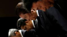 Mitsubishi Materials Corp. President Akira Takeuchi bows with Executive Vice President Naoki Ono , Mitsubishi Shindoh Co. President Kazumasa Hori and Mitsubishi Cable Industries Ltd. President Nobuhiro Takayanagi during a news conference in Tokyo, Japan 