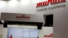 FILE PHOTO: Logos of Murata Manufacturing Co are pictured at CEATEC (Combined Exhibition of Advanced Technologies) JAPAN 2016 at the Makuhari Messe in Chiba, Japan, October 3, 2016.   REUTERS/Toru Hanai/File Photo 