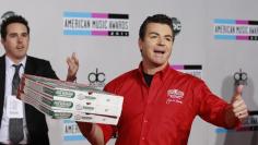 John Schnatter, founder and CEO of Papa John's Pizza, arrives at the 2011 American Music Awards in Los Angeles